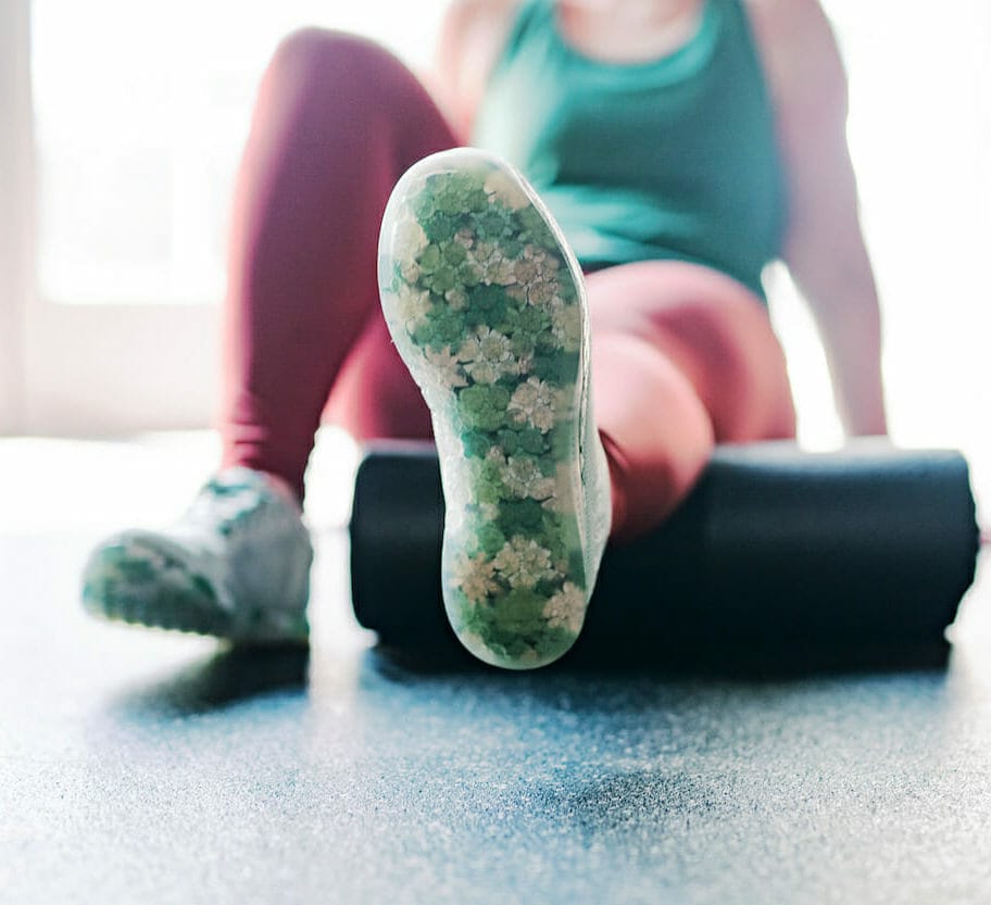 Patient foam rolling while trying to maintain their physiotherapy program. 